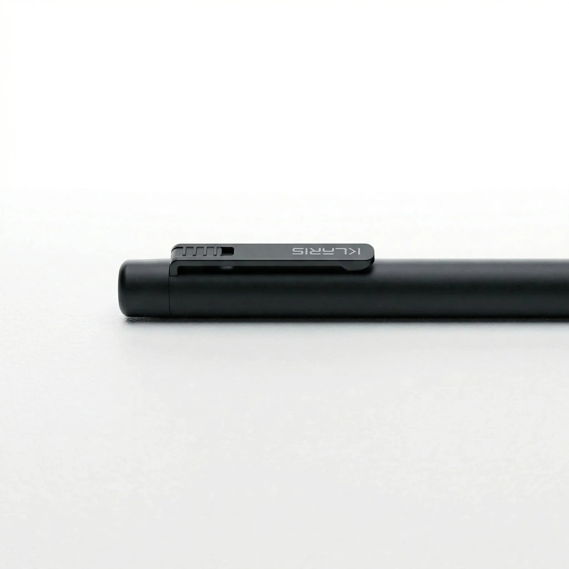 Sleek black smart AI note-taking pen with minimalist design on a white background KlarisPen